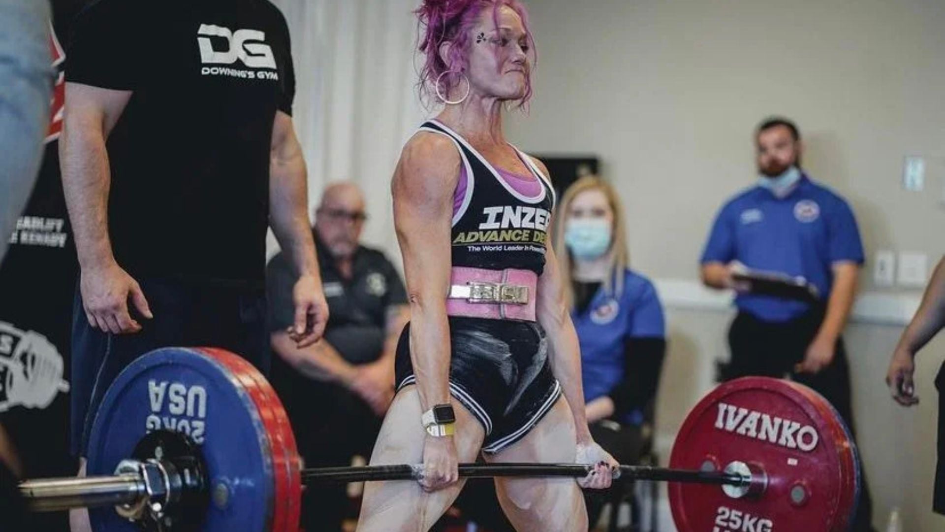 Powerlifter performing a deadlift during a powerlifting competition