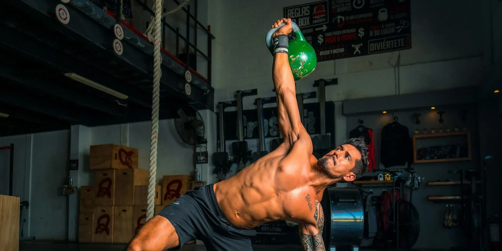Athlete performing crossfit exercise using kettlebell 