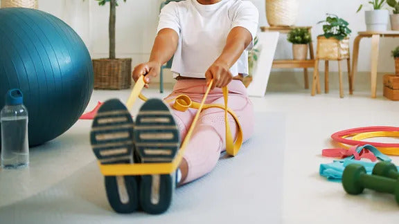 Person performing a resistance band arthritis workout to improve joint mobility